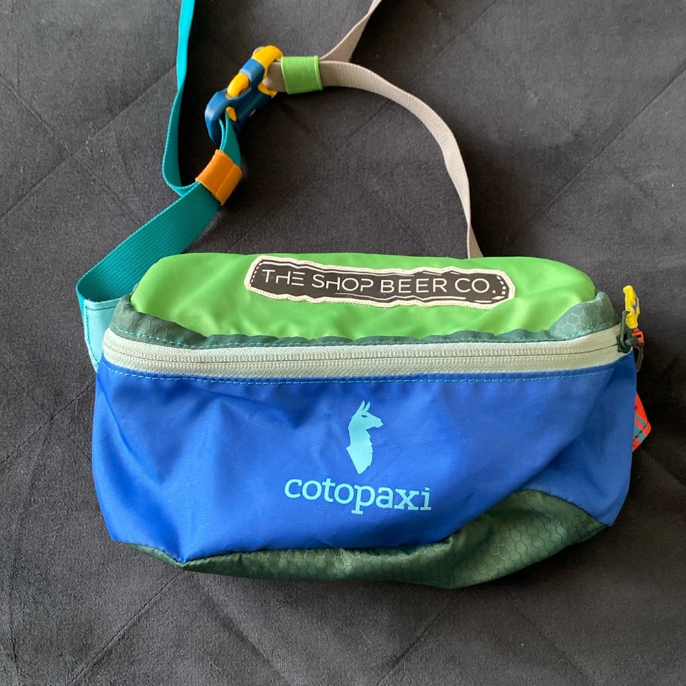 cotopaxi green blue waist pack